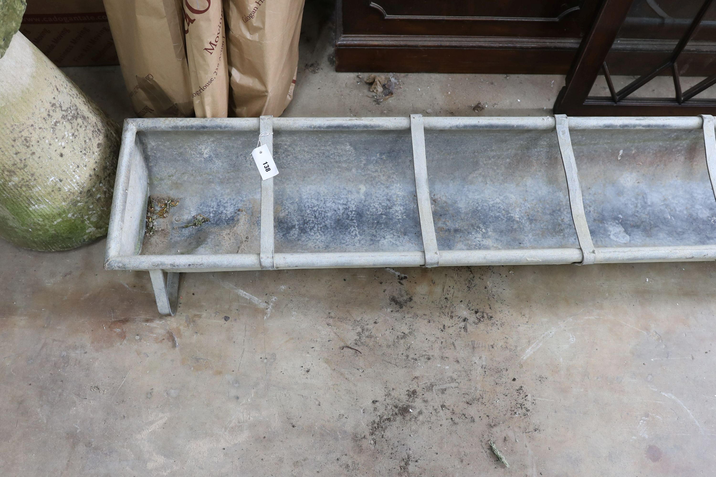 A large vintage galvanised water trough, length 246cm, depth 34cm, height 20cm